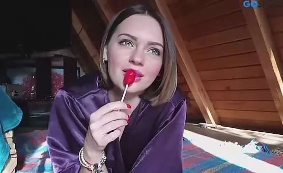 Spreading Her Legs Girl Indulges Passionate Licking of a Juicy Lollipop